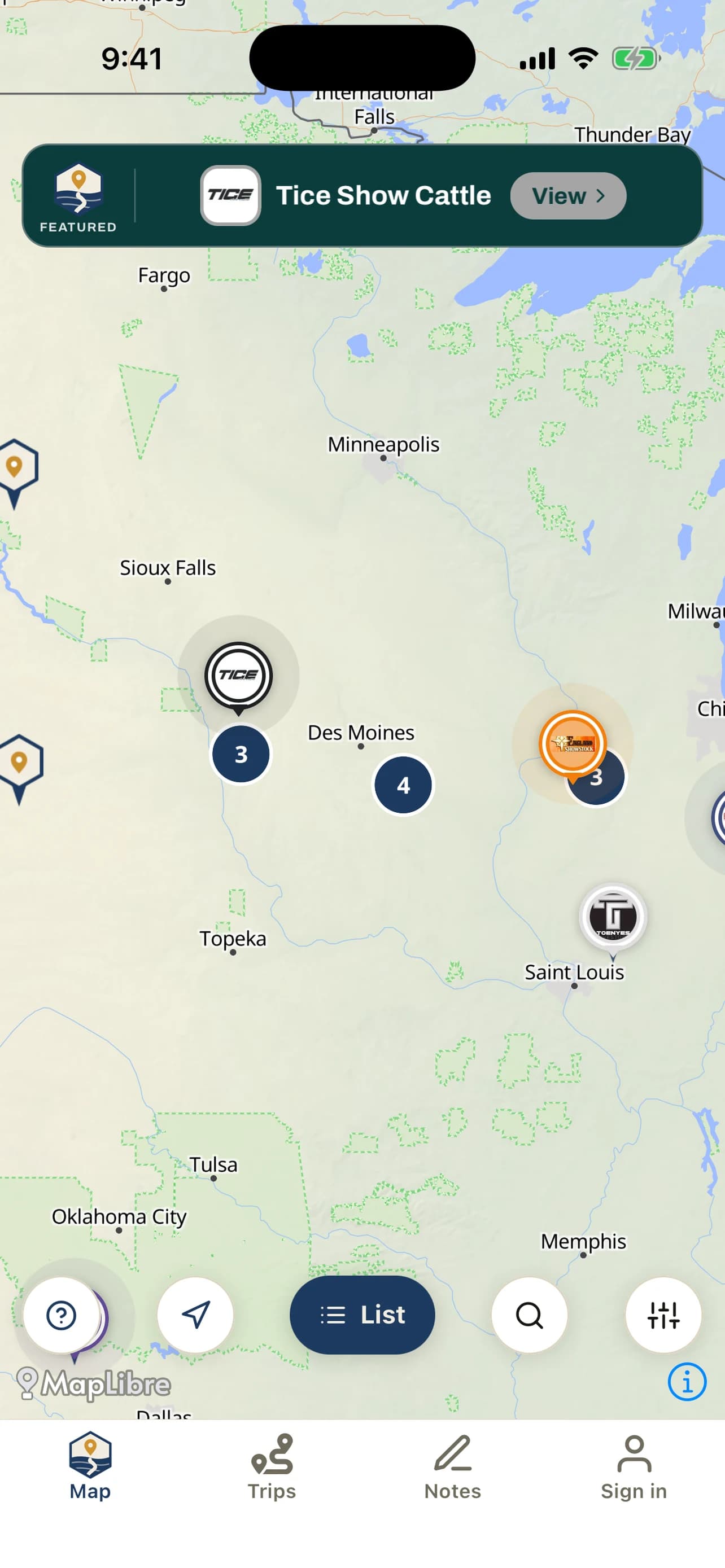 The ShowNav map with a promoted operation's featured banner across the top — their logo, their brand colour and a View button — above map pins carrying their own logos.
